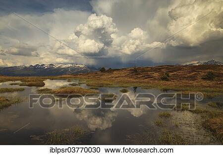 "Clouds over a pond, Zillertal valley, Tyrol, Austria, Europe" View Large Photo Image Stock Image - "Clouds over a pond, Zillertal valley, Tyrol, Austria, Europe". Fotosearch