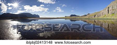 Clouds with their reflection in the water, Hornstrandir, Westfjords, Iceland, Europe View Large Photo Image Stock Photo - Clouds with their reflection in the water, Hornstrandir, Westfjords, Iceland, Europe. Fotosearch