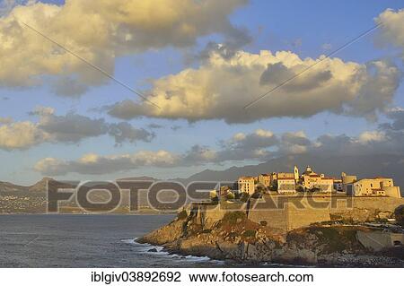 "Cloudy atmosphere over the citadel in the evening light, Calvi, Corsica, France, Europe" View Large Photo Image Stock Image - "Cloudy atmosphere over the citadel in the evening light, Calvi, Corsica, France, Europe". Fotosearch