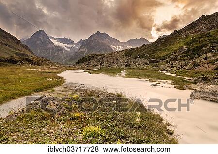 "Cloudy atmosphere over the raised mire of Breites Wasser, view towards Jamtal Valley, Jamtal, Galtur, North Tyrol, Austria, Europe" View Large Photo Image Stock Photo - "Cloudy atmosphere over the raised mire of Breites Wasser, view towards Jamtal Valley, Jamtal, Galtur, North Tyrol, Austria, Europe". Fotosearch