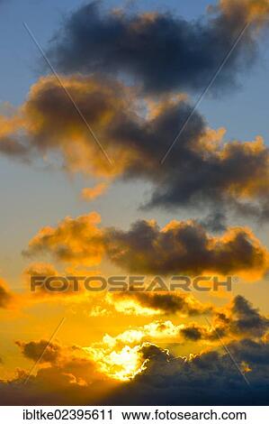 Cloudy sky at sunset View Large Photo Image Stock Image - Cloudy sky at sunset. Fotosearch