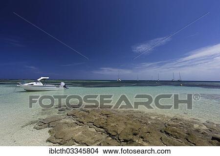 "Coast of the South Seas island of Amedee with a view towards the largest lagoon in the world, with sail boats and motor boats, Amedee Island, New Caledonia, France, Oceania" View Large Photo Image Picture - "Coast of the South Seas island of Amedee with a view towards the largest lagoon in the world, with sail boats and motor boats, Amedee Island, New Caledonia, France, Oceania". Fotosearch