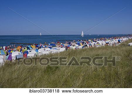 "Coast with roofed wicker beach chairs on a beach, Kuhlungsborn, Mecklenburg-Western Pomerania, Germany, Europe" View Large Photo Image Stock Photo - "Coast with roofed wicker beach chairs on a beach, Kuhlungsborn, Mecklenburg-Western Pomerania, Germany, Europe". Fotosearch