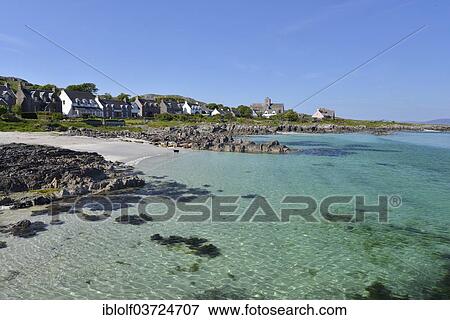 Stock Photo - "Coast with the pilgrimage destination of Iona Abbey, monastery complex and port on the Scottish Hebridean island of Iona, Inner Hebrides, Scotland, United Kingdom, Europe". Fotosearch
