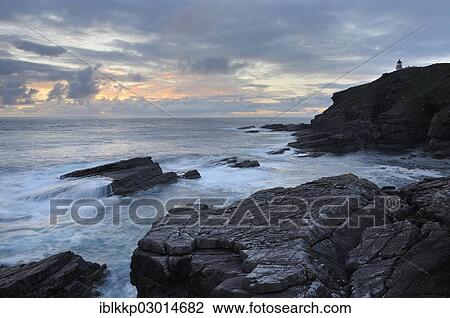 "Coastal cliffs and rocks with a lighthouse on the Atlantic Ocean in the evening, Northern Highlands, Highlands, Sutherland County, Highland, Scotland, United Kingdom, Europe" View Large Photo Image Stock Image - "Coastal cliffs and rocks with a lighthouse on the Atlantic Ocean in the evening, Northern Highlands, Highlands, Sutherland County, Highland, Scotland, United Kingdom, Europe". Fotosearch