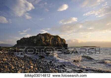Stock Image - "Coastal landscape with rocks in the evening light, Schottland, Isle of Skye, Scotland, United Kingdom, Europe". Fotosearch