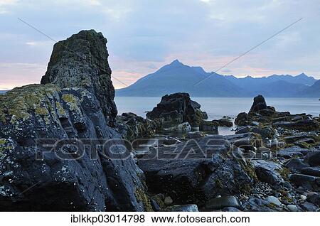 Stock Photo - "Coastal landscape with rocks in the evening light, Elgol, Isle of Skye, United Kingdom, Europe". Fotosearch