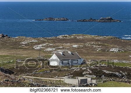 Stock Image - "Coastal landscape with typical Irish house, Atlantic Drive, Letterkenny, County Donegal, Republic of Ireland, Europe". Fotosearch