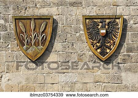 Stock Photo - "Coat of arms for the Free Imperial City of Dinkelsbuehl next to the Imperial Eagle, Woernitz Gate, Dinkelsbuhl, Middle Franconia, Bavaria, Germany, Europe". Fotosearch