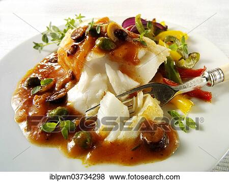 Cod fillet with a ragu and caper sauce View Large Photo Image Stock Photo - Cod fillet with a ragu and caper sauce. Fotosearch