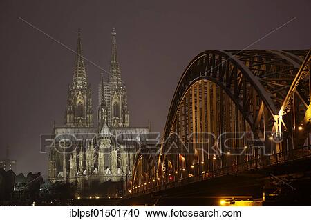 "Cologne Cathedral and Hohenzollern Bridge illuminated in Winter, Cologne, North Rhine-Westphalia, Germany, Europe" View Large Photo Image Stock Image - "Cologne Cathedral and Hohenzollern Bridge illuminated in Winter, Cologne, North Rhine-Westphalia, Germany, Europe". Fotosearch