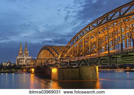 "Cologne Cathedral with Hohenzollern Bridge and Cologne Philharmonic Hall at dusk, the Rhine at the front, Cologne, North Rhine-Westphalia, Germany, Europe" View Large Photo Image Stock Image - "Cologne Cathedral with Hohenzollern Bridge and Cologne Philharmonic Hall at dusk, the Rhine at the front, Cologne, North Rhine-Westphalia, Germany, Europe". Fotosearch