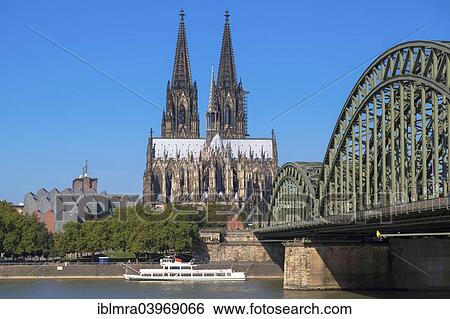 "Cologne Cathedral with Hohenzollern bridge and Philharmonie, Rhine at the front, Cologne, North Rhine-Westphalia, Germany, Europe" View Large Photo Image Stock Photograph - "Cologne Cathedral with Hohenzollern bridge and Philharmonie, Rhine at the front, Cologne, North Rhine-Westphalia, Germany, Europe". Fotosearch