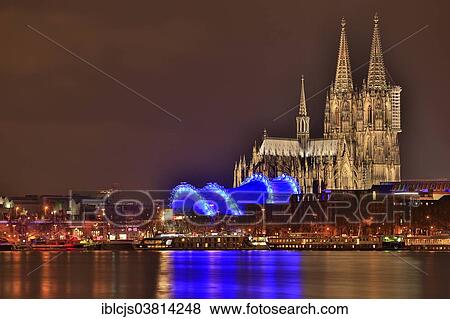 "Cologne Cathedral with the """"Cologne Opera at the Cathedral"""" at night, Rhine at the front, Cologne, North Rhine-Westphalia, Germany, Europe" View Large Photo Image Stock Photo - "Cologne Cathedral with the """"Cologne Opera at the Cathedral"""" at night, Rhine at the front, Cologne, North Rhine-Westphalia, Germany, Europe". Fotosearch