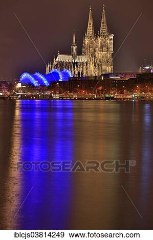 "Cologne Cathedral with the """"Cologne Opera at the Cathedral"""" at night, Rhine at the front, Cologne, North Rhine-Westphalia, Germany, Europe" View Large Photo Image Stock Photo - "Cologne Cathedral with the """"Cologne Opera at the Cathedral"""" at night, Rhine at the front, Cologne, North Rhine-Westphalia, Germany, Europe". Fotosearch