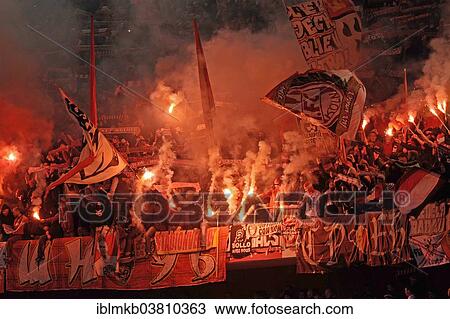 Stock Image - "Cologne fans burning flares, Esprit Arena, Dusseldorf, North Rhine-Westphalia, Germany, Europe". Fotosearch
