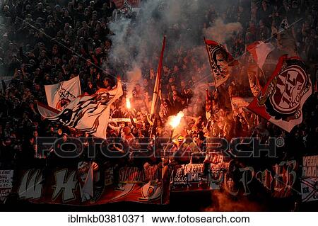 Stock Image - "Cologne fans burning flares, Esprit Arena, Dusseldorf, North Rhine-Westphalia, Germany, Europe". Fotosearch