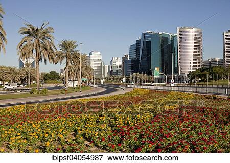 Stock Photo - "Colorful flower bed and skyscrapers, Dubai, Emirate of Dubai, United Arab Emirates, Asia". Fotosearch