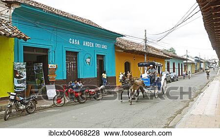 "Colorful houses on a street, horse-drawn carriage passing by, Granada, province of Granada, Nicaragua, North America" View Large Photo Image Stock Photo - "Colorful houses on a street, horse-drawn carriage passing by, Granada, province of Granada, Nicaragua, North America". Fotosearch