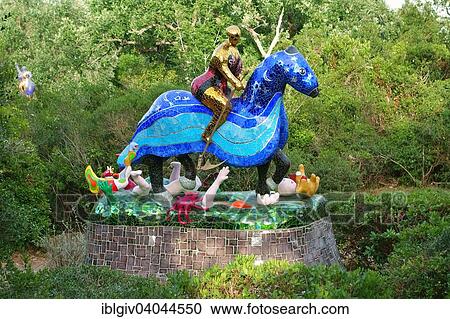 "Colorful sculpture in the Giardino dei Tarocchi or Garden of the Tarot, by Niki de Saint Phalle and Jean Tinguely in Capalbio, Province of Grosseto, Tuscany, Italy, Europe" View Large Photo Image Stock Image - "Colorful sculpture in the Giardino dei Tarocchi or Garden of the Tarot, by Niki de Saint Phalle and Jean Tinguely in Capalbio, Province of Grosseto, Tuscany, Italy, Europe". Fotosearch