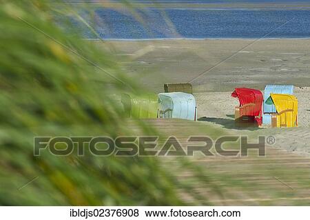 Stock Photo - "Colourful beach chairs on the beach of Utersum, Foehr island, North Frisia, Schleswig-Holstein, Germany, Europe". Fotosearch