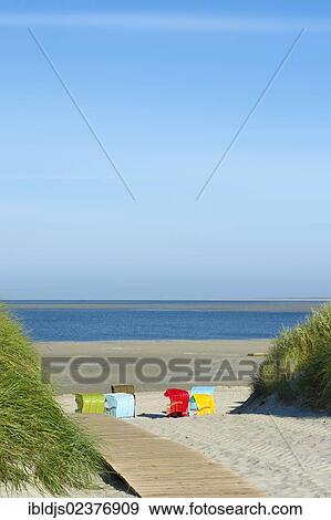 "Colourful beach chairs on the beach of Utersum, Foehr island, North Frisia, Schleswig-Holstein, Germany, Europe" View Large Photo Image Stock Photo - "Colourful beach chairs on the beach of Utersum, Foehr island, North Frisia, Schleswig-Holstein, Germany, Europe". Fotosearch