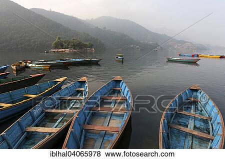"Colourful boats on Phewa Lake, Phewa Tal or Fewa Lake, Pokhara, Nepal, Asia" View Large Photo Image Stock Photo - "Colourful boats on Phewa Lake, Phewa Tal or Fewa Lake, Pokhara, Nepal, Asia". Fotosearch