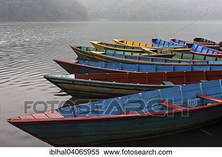 "Colourful boats on Phewa Lake, Phewa Tal or Fewa Lake, Pokhara, Nepal, Asia" View Large Photo Image Stock Photography - "Colourful boats on Phewa Lake, Phewa Tal or Fewa Lake, Pokhara, Nepal, Asia". Fotosearch