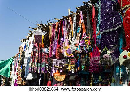 Picture - "Colourful clothes and bags for sale at the weekly flea market, Anjuna, Goa, India, Asia". Fotosearch
