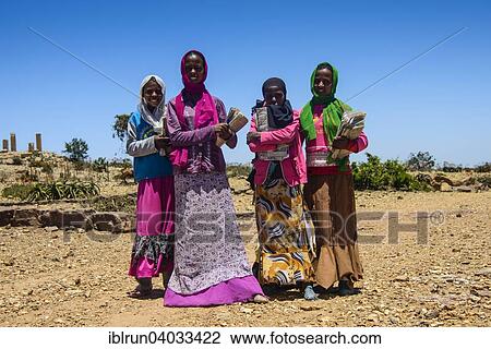 Stock Image - "Colourful dressed schoolgirls, Qohaito, Eritrea, Africa". Fotosearch