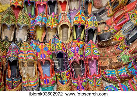 Stock Image - "Colourful embroidered traditional shoes at the market, Jodhpur, Rajasthan, India, Asia". Fotosearch