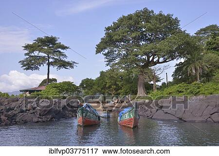 Stock Photo - "Colourful fishing boats, near Kent, Western Area, Sierra Leone, Africa". Fotosearch