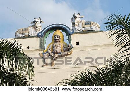 "Colourful guardian figure flanked by Nandi, Shiva's mount, on a temple wall, Meenakshi Amman Temple or Sri Meenakshi Sundareswarar Temple, Madurai, Tamil Nadu, India, Asia" View Large Photo Image Stock Image - "Colourful guardian figure flanked by Nandi, Shiva's mount, on a temple wall, Meenakshi Amman Temple or Sri Meenakshi Sundareswarar Temple, Madurai, Tamil Nadu, India, Asia". Fotosearch