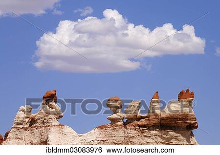 Stock Photograph - "Colourful hoodoos, sandstone formations, with cumulus clouds, Blue Canyon, Arizona, United States, North America". Fotosearch