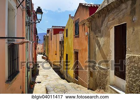 "Colourful houses in a narrow alleyway of the historic centre, Bosa, Oristano Province, Sardinia, Italy, Europe" View Large Photo Image Stock Photo - "Colourful houses in a narrow alleyway of the historic centre, Bosa, Oristano Province, Sardinia, Italy, Europe". Fotosearch