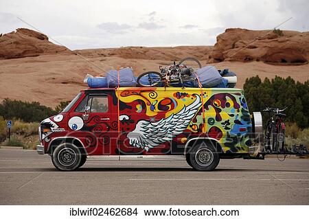 "Colourful painted, fully-packed minibus in front of a rocky landscape, Utah, USA" View Large Photo Image Picture - "Colourful painted, fully-packed minibus in front of a rocky landscape, Utah, USA". Fotosearch