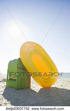 "Colourful roofed wicker beach chair and a yellow inflatable boat, Amrum, North Frisian Islands, Schleswig-Holstein, Germany, Europe" View Large Photo Image Stock Image - "Colourful roofed wicker beach chair and a yellow inflatable boat, Amrum, North Frisian Islands, Schleswig-Holstein, Germany, Europe". Fotosearch