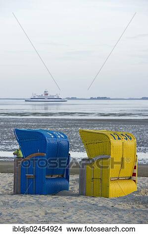 "Colourful roofed wicker beach chairs on the beach near Wyk, Foehr Island, North Frisian Islands, Schleswig-Holstein, Germany, Europe" View Large Photo Image Picture - "Colourful roofed wicker beach chairs on the beach near Wyk, Foehr Island, North Frisian Islands, Schleswig-Holstein, Germany, Europe". Fotosearch