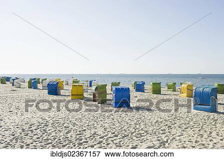 "Colourful roofed wicker beach chairs on the beach, Wyk, Foehr, North Frisia, Schleswig-Holstein, Germany, Europe" View Large Photo Image Stock Photo - "Colourful roofed wicker beach chairs on the beach, Wyk, Foehr, North Frisia, Schleswig-Holstein, Germany, Europe". Fotosearch