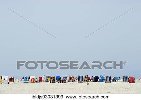 "Colourful roofed wicker beach chairs on the beach, Norddorf, Amrum, Amrum, North Frisian Islands, Schleswig-Holstein, Germany, Europe" View Large Photo Image Stock Photo - "Colourful roofed wicker beach chairs on the beach, Norddorf, Amrum, Amrum, North Frisian Islands, Schleswig-Holstein, Germany, Europe". Fotosearch