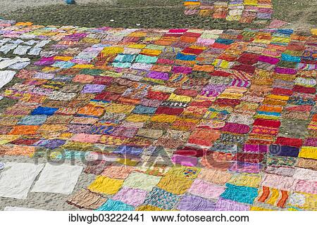 "Colourful saris laying to dry after washing on a sandbank on the banks of the Yamuna River, Yamuna, Agra, Uttar Pradesh, India, Asia" View Large Photo Image Stock Image - "Colourful saris laying to dry after washing on a sandbank on the banks of the Yamuna River, Yamuna, Agra, Uttar Pradesh, India, Asia". Fotosearch