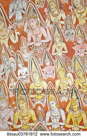 Stock Image - "Colourful wall painting, fresco, praying gods with nimbus, halo, Maharaja-Iena cave, Buddhist cave temple of Dambulla, Golden Temple of Dambulla, Central Province, Sri Lanka, Asia". Fotosearch