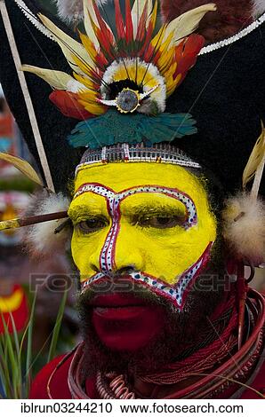 "Colourfully decorated and painted man celebrating the traditional Sing Sing in the highlands, Enga, Highlands, Papua New Guinea, Oceania" View Large Photo Image Stock Image - "Colourfully decorated and painted man celebrating the traditional Sing Sing in the highlands, Enga, Highlands, Papua New Guinea, Oceania". Fotosearch