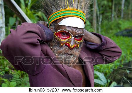 "Colourfully decorated and painted man celebrating the traditional Sing Sing in the highlands, Paya, Papua New Guinea, Oceania" View Large Photo Image Stock Photo - "Colourfully decorated and painted man celebrating the traditional Sing Sing in the highlands, Paya, Papua New Guinea, Oceania". Fotosearch