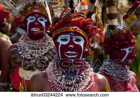 "Colourfully decorated and painted tribesmen celebrating the traditional Sing Sing in the highlands, Enga, Highlands, Papua New Guinea, Oceania" View Large Photo Image Picture - "Colourfully decorated and painted tribesmen celebrating the traditional Sing Sing in the highlands, Enga, Highlands, Papua New Guinea, Oceania". Fotosearch