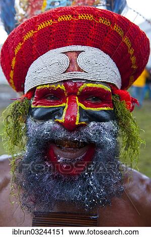 "Colourfully decorated and painted tribesman celebrating the traditional Sing Sing in the highlands, Enga, Highlands, Papua New Guinea, Oceania" View Large Photo Image Stock Image - "Colourfully decorated and painted tribesman celebrating the traditional Sing Sing in the highlands, Enga, Highlands, Papua New Guinea, Oceania". Fotosearch