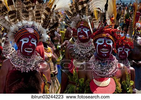 "Colourfully decorated and painted tribesmen celebrating the traditional Sing Sing in the highlands, Enga, Highlands, Papua New Guinea, Oceania" View Large Photo Image Stock Image - "Colourfully decorated and painted tribesmen celebrating the traditional Sing Sing in the highlands, Enga, Highlands, Papua New Guinea, Oceania". Fotosearch