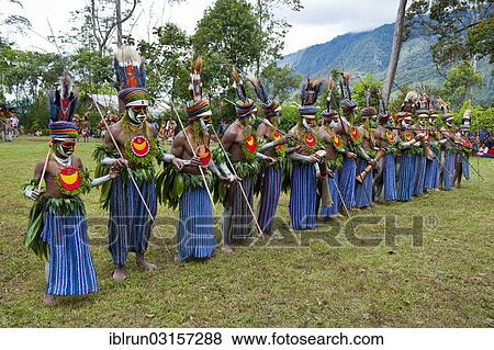 "Colourfully decorated and painted tribesmen celebrating the traditional Sing Sing in the highlands, Paya, Highlands, Papua New Guinea, Oceania" View Large Photo Image Stock Photo - "Colourfully decorated and painted tribesmen celebrating the traditional Sing Sing in the highlands, Paya, Highlands, Papua New Guinea, Oceania". Fotosearch