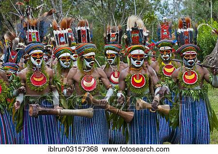 "Colourfully decorated and painted tribesmen celebrating the traditional Sing Sing in the highlands, Paya, Highlands, Papua New Guinea, Oceania" View Large Photo Image Stock Photo - "Colourfully decorated and painted tribesmen celebrating the traditional Sing Sing in the highlands, Paya, Highlands, Papua New Guinea, Oceania". Fotosearch