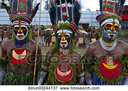 "Colourfully decorated and painted tribesmen celebrating the traditional Sing Sing in the highlands, Enga, Highlands, Papua New Guinea, Oceania" View Large Photo Image Stock Photo - "Colourfully decorated and painted tribesmen celebrating the traditional Sing Sing in the highlands, Enga, Highlands, Papua New Guinea, Oceania". Fotosearch